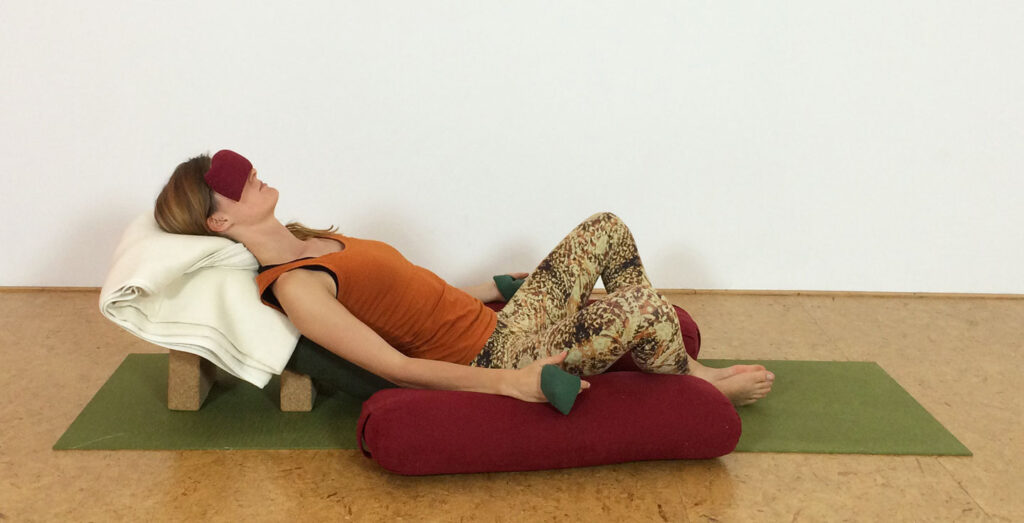 Reclining butterfly restorative yoga pose
